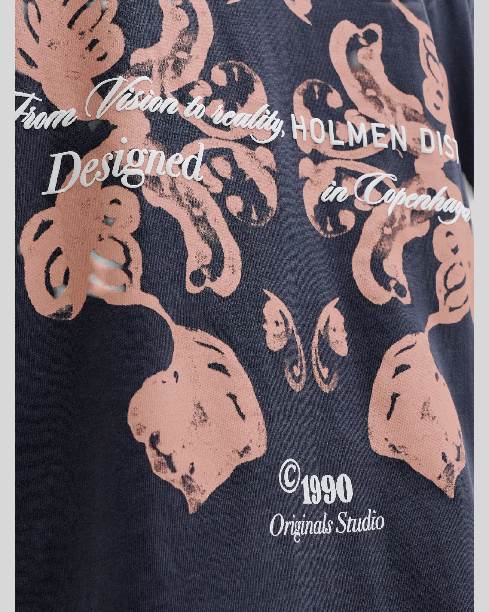 Brillantina Store grey 100% cotton t-shirt with graphic print and text 'From Vision to reality, HOLMEN DIST Designed in Copenhagen 1990 Originals Studio'.