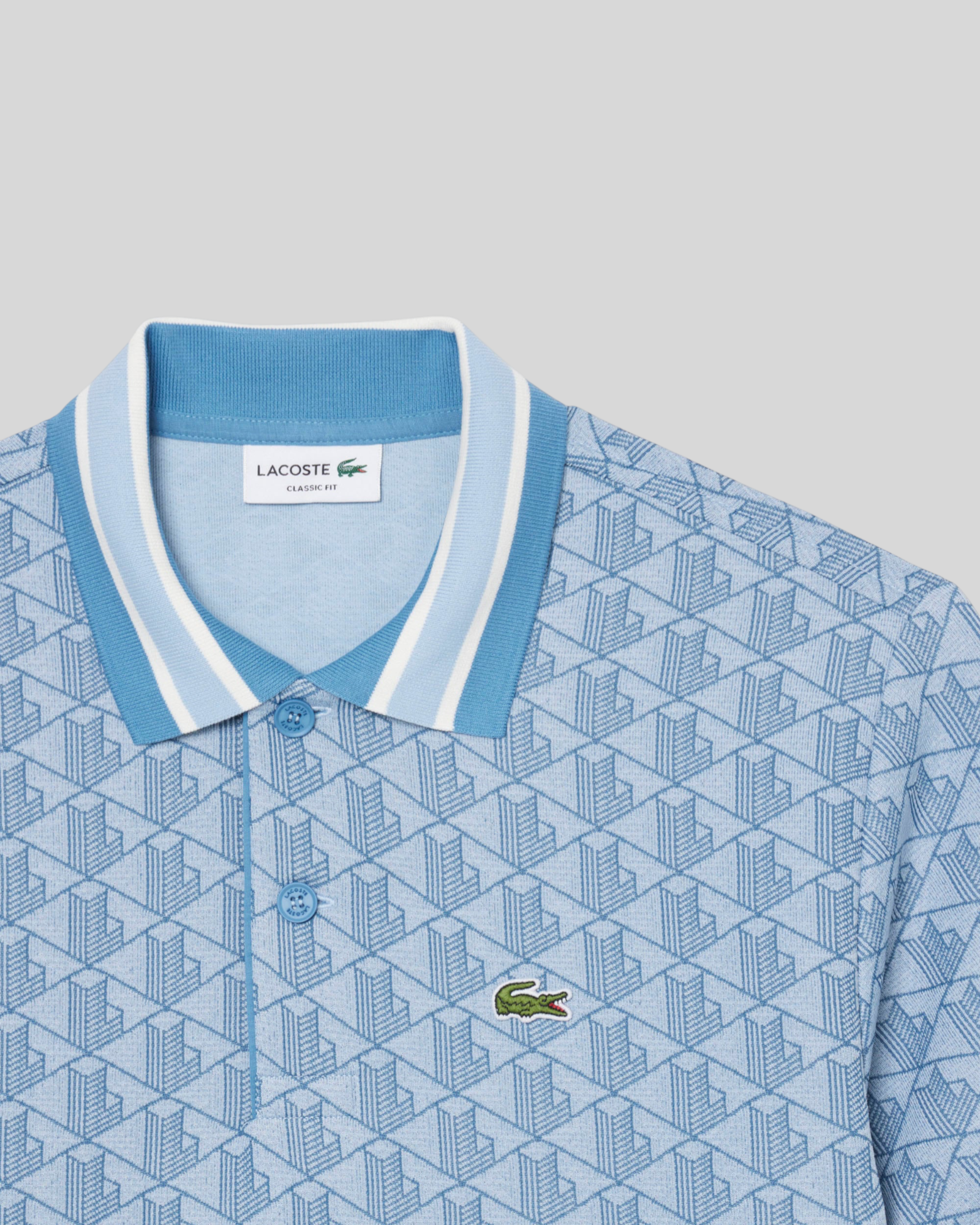 Brillantina Store light blue jacquard polo shirt with all-over monogram pattern and contrast striped collar.